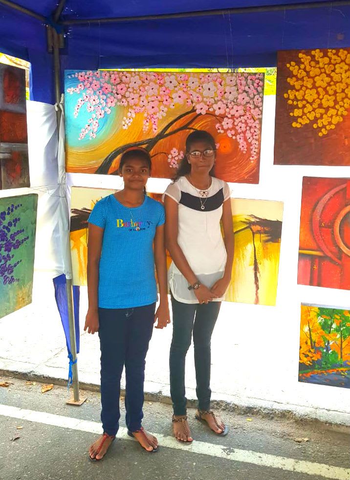 Two girls enjoying the art fair